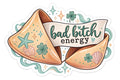 Bad Bitch Energy fortune cookie sticker with teal clovers, seashells, starfish, sparkles and coastal waves