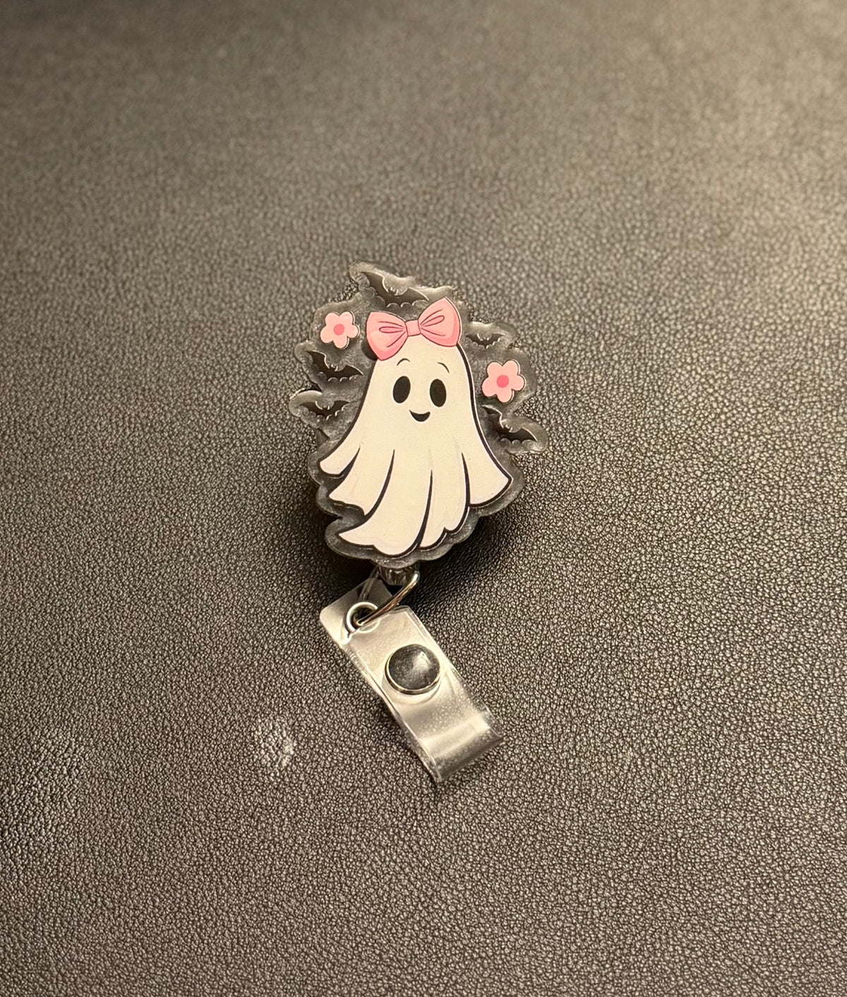 Cute ghost badge reel with pink bow, pink flowers, black bats and retractable clip