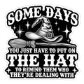 Black and white witch hat and broom sticker with text Somedays You Just Have To Put On The Hat To Remind Them Who They're Dealing With